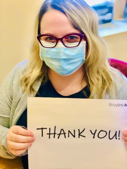 Health care staff with thank you sign